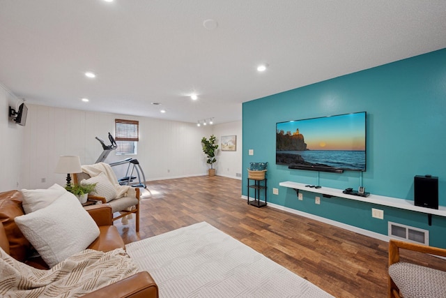 11 6th Ave S, Sartell, MN 56377 - living room featuring wood finished floors and recessed lighting