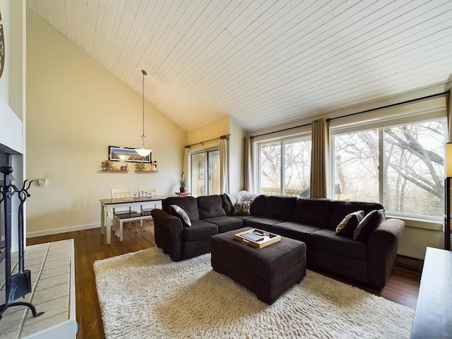 living room featuring wood ceiling, wood finished floors, high vaulted ceiling, baseboards, and a baseboard heating unit