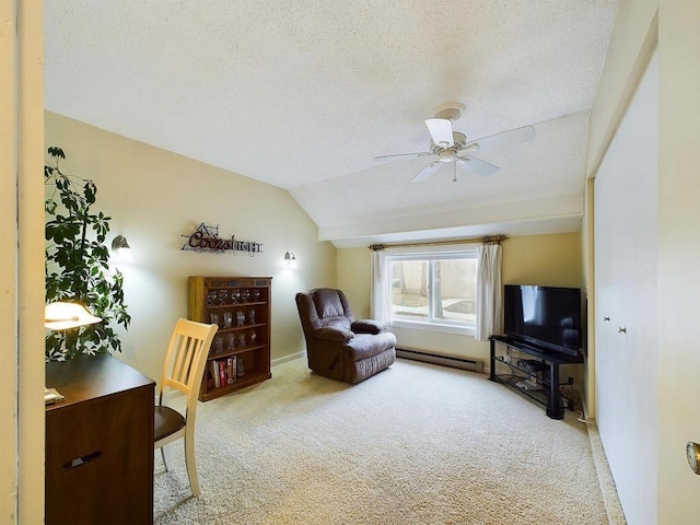 sitting room featuring carpet flooring, a textured ceiling, ceiling fan, and vaulted ceiling