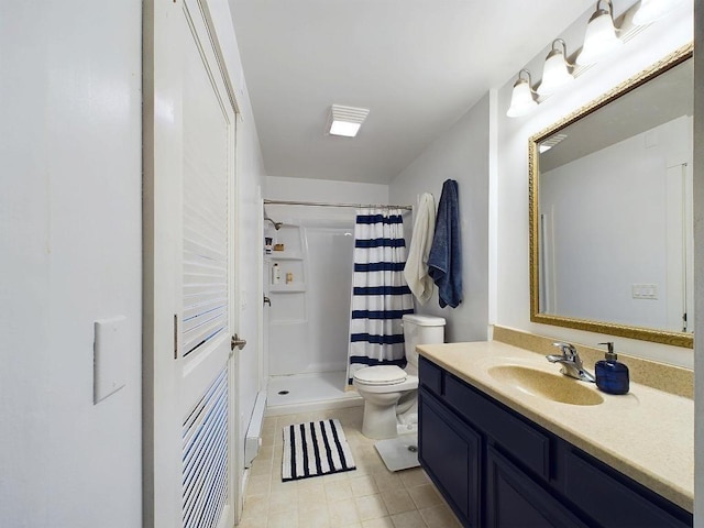 bathroom featuring vanity, tile patterned flooring, a shower stall, and toilet