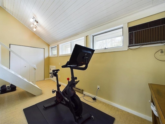 exercise room featuring wood ceiling, vaulted ceiling, carpet floors, baseboards, and an AC wall unit