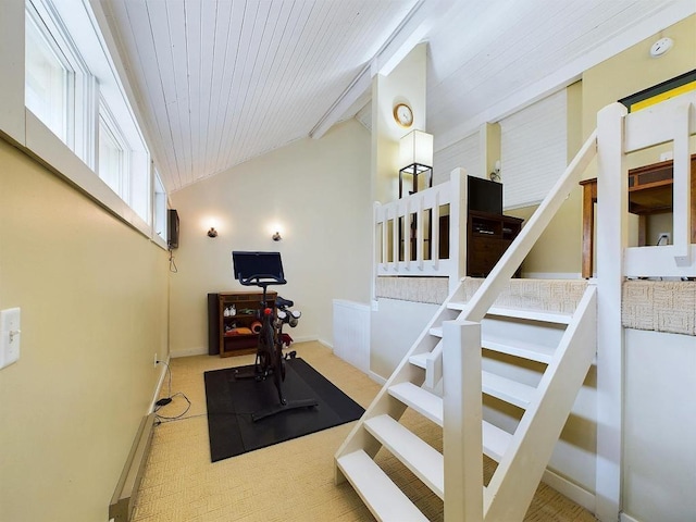 workout area featuring wood ceiling, baseboards, vaulted ceiling, and carpet floors