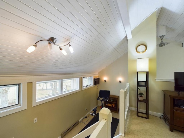 interior space with light colored carpet, baseboards, vaulted ceiling, and wood ceiling