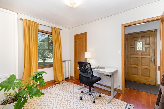 office space with wood finished floors and baseboards