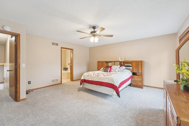 bedroom with visible vents and light carpet
