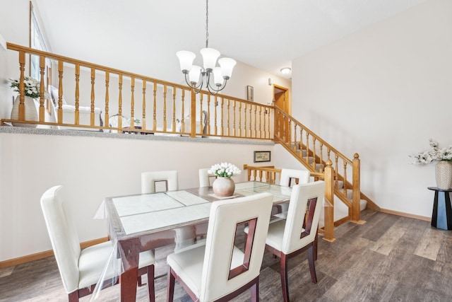 dining room featuring an inviting chandelier, baseboards, stairs, and wood finished floors