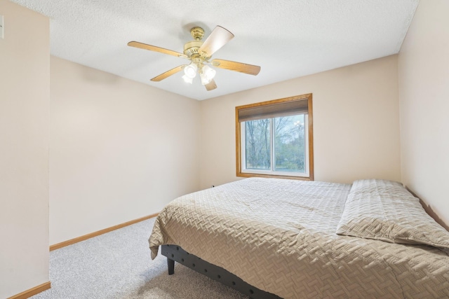 bedroom with baseboards, ceiling fan, and carpet