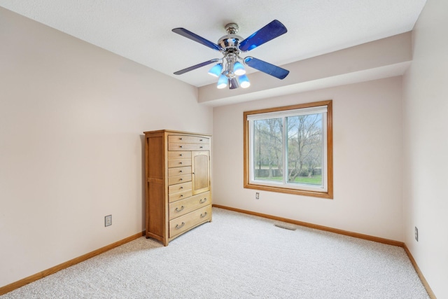 bedroom featuring baseboards, light colored carpet, and visible vents
