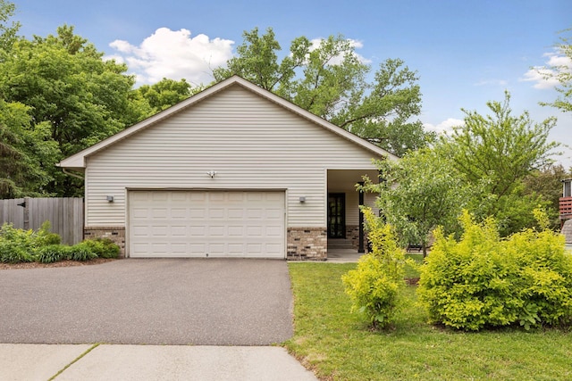 1283 Bidwell St, West Saint Paul, MN 55118 - view of front facade featuring brick siding, driveway, and an attached garage