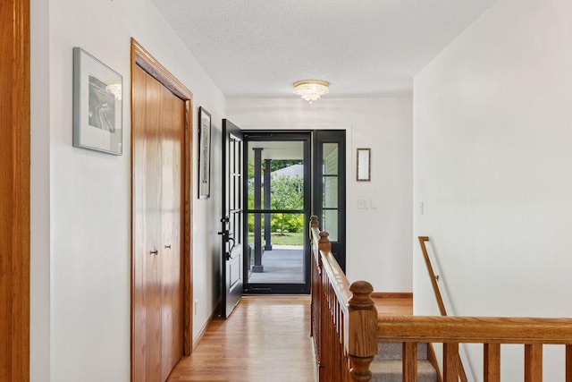 1283 Bidwell St, West Saint Paul, MN 55118 - doorway with light wood-type flooring and baseboards