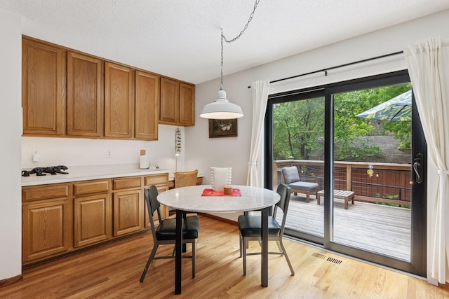 1283 Bidwell St, West Saint Paul, MN 55118 - dining space with light wood-style floors