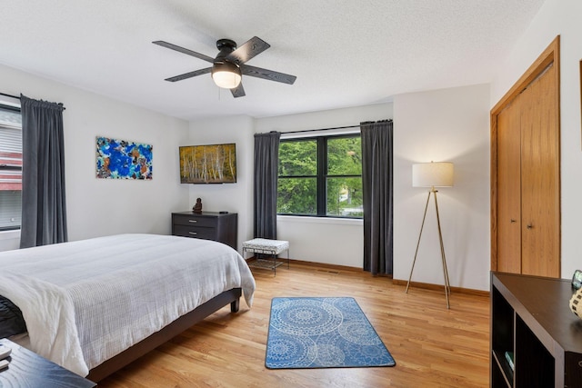 1283 Bidwell St, West Saint Paul, MN 55118 - bedroom featuring light wood finished floors, baseboards, and a ceiling fan