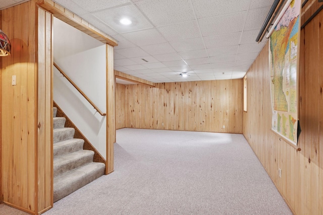 1283 Bidwell St, West Saint Paul, MN 55118 - finished below grade area featuring carpet, wood walls, stairway, and a paneled ceiling