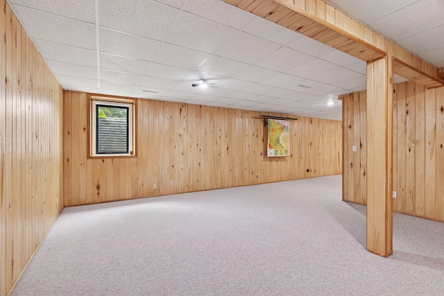 1283 Bidwell St, West Saint Paul, MN 55118 - basement featuring carpet floors, a paneled ceiling, and wood walls