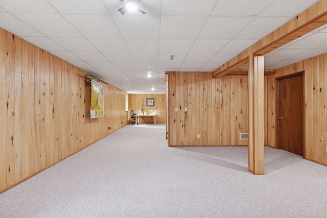 1283 Bidwell St, West Saint Paul, MN 55118 - below grade area with carpet flooring, wooden walls, and a paneled ceiling
