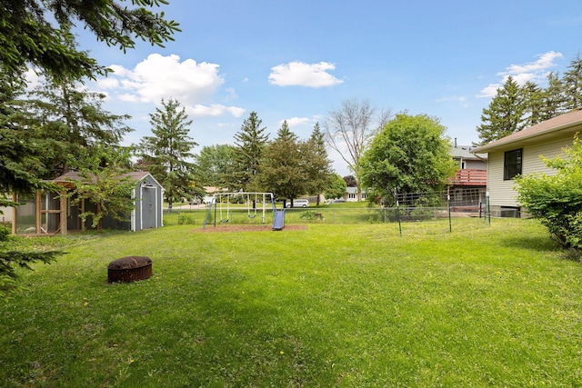 1283 Bidwell St, West Saint Paul, MN 55118 - view of yard with an outdoor fire pit and a playground