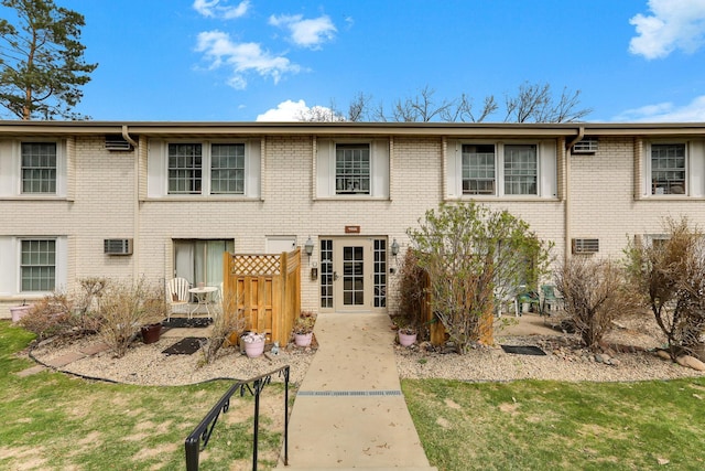 4566 Cedar Lake Rd S Unit 3, Saint Louis Park, MN 55416 - back of property with a wall mounted air conditioner and brick siding
