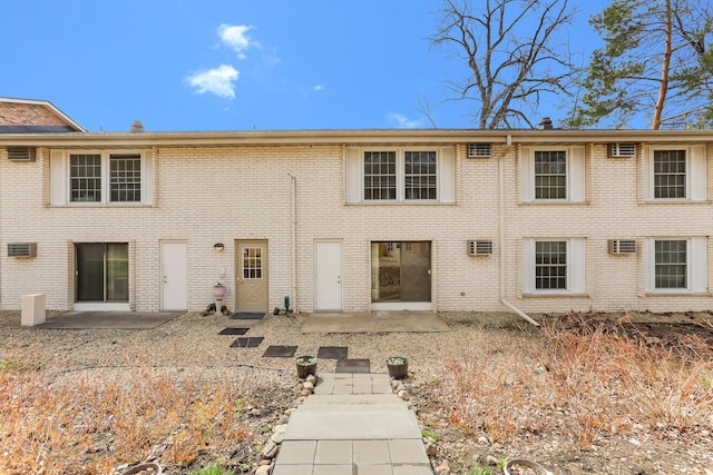 4566 Cedar Lake Rd S Unit 3, Saint Louis Park, MN 55416 - back of house featuring a patio area and brick siding