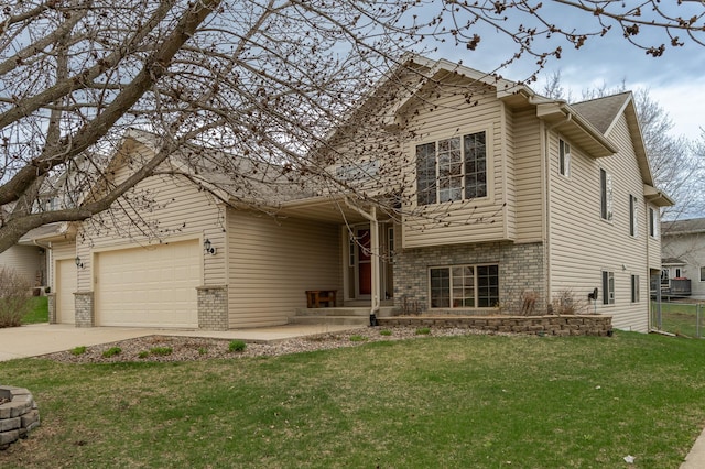 4434 Arcon Ln NW, Rochester, MN 55901 - tri-level home with a front yard, driveway, a garage, and brick siding
