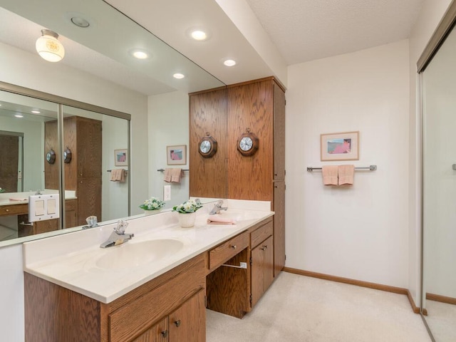 5501 Dewey Hill Rd Unit 233, Edina, MN 55439 - bathroom with recessed lighting, double vanity, baseboards, and a sink