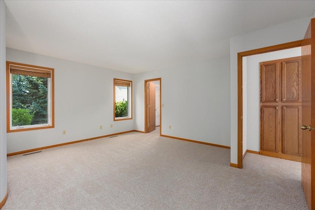2228 White Pine Ct, Hudson, WI 54016 - spare room featuring light carpet and healthy amount of natural light