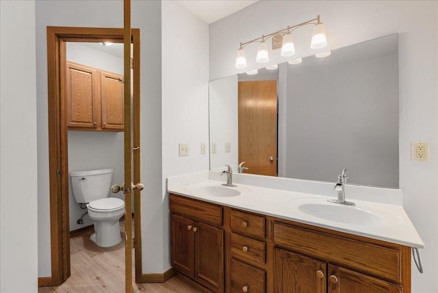 2228 White Pine Ct, Hudson, WI 54016 - bathroom with double vanity and wood finished floors