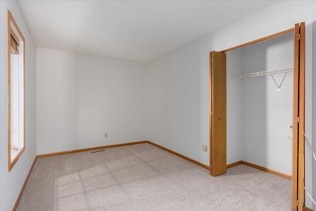 2228 White Pine Ct, Hudson, WI 54016 - unfurnished bedroom with carpet floors and a closet