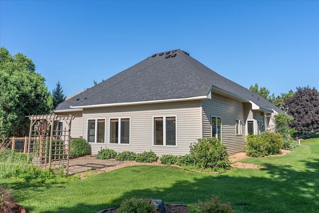 2228 White Pine Ct, Hudson, WI 54016 - rear view of house featuring a pergola, a yard, roof with shingles, and a patio