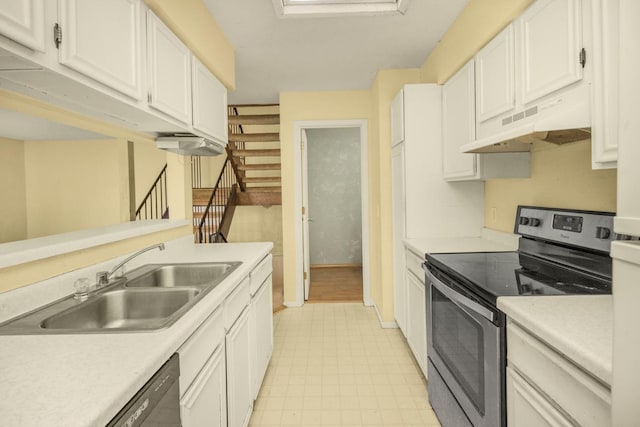 kitchen featuring a sink, light countertops, under cabinet range hood, electric stove, and light floors