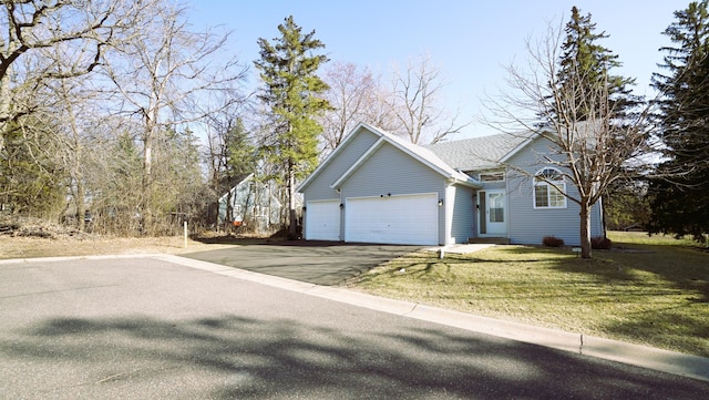 view of property exterior with driveway, a yard, and a garage