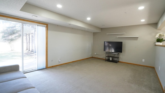 unfurnished living room with plenty of natural light, carpet flooring, and recessed lighting