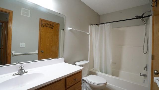 bathroom featuring toilet, visible vents, shower / tub combo, and vanity