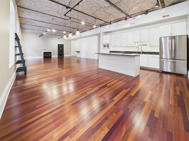 300 Wall St Unit 201, Saint Paul, MN 55101 - kitchen with stainless steel appliances, rail lighting, open floor plan, and dark countertops