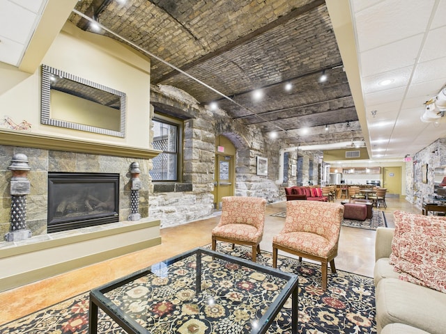 300 Wall St Unit 201, Saint Paul, MN 55101 - living room with brick ceiling and a glass covered fireplace