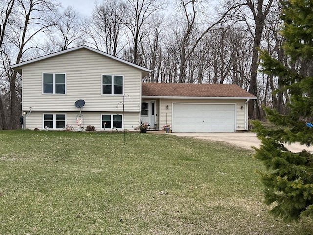 split level home with concrete driveway, a shingled roof, a front lawn, and a garage