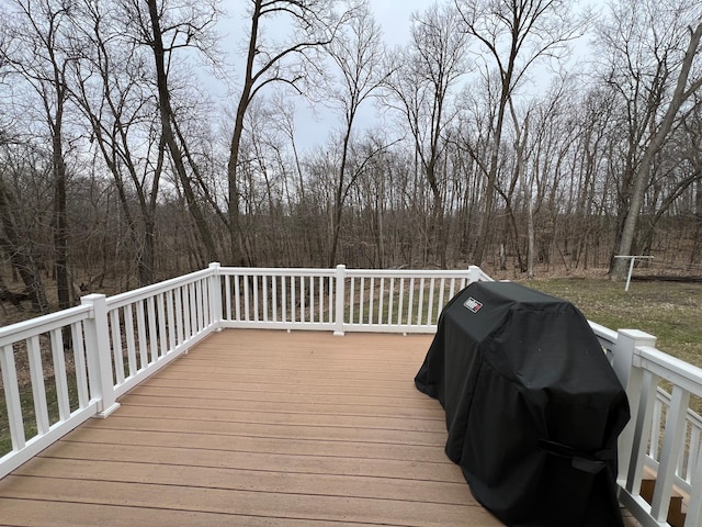 wooden terrace featuring area for grilling
