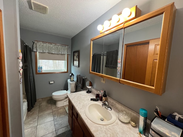 full bath with toilet, a textured ceiling, visible vents, and vanity
