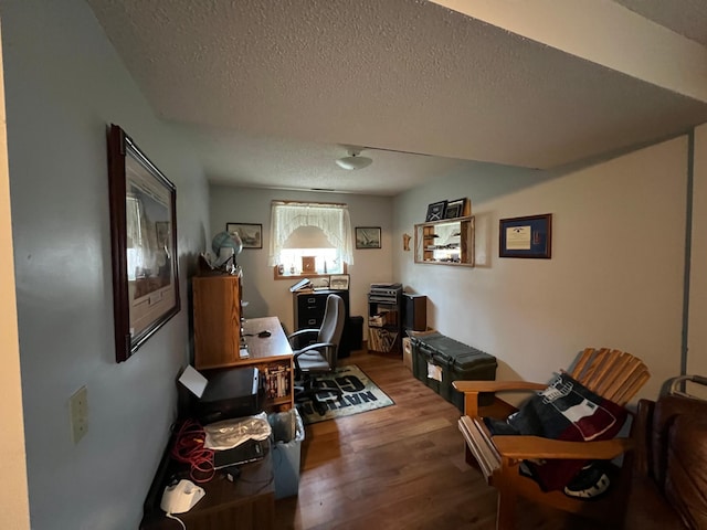 office space featuring a textured ceiling and wood finished floors