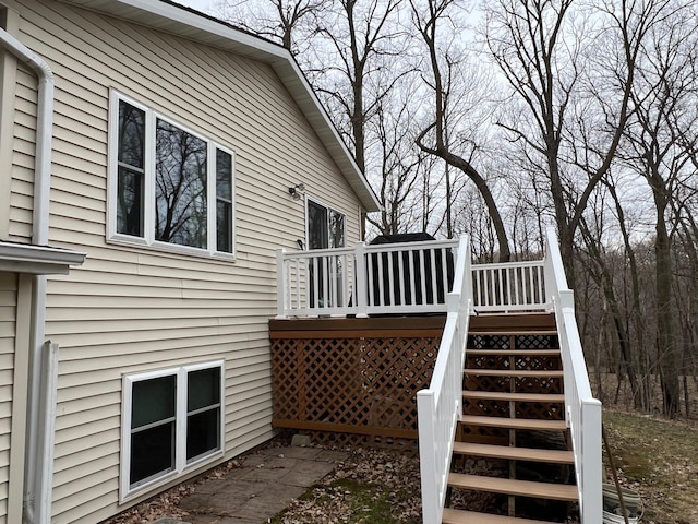 wooden deck featuring stairs