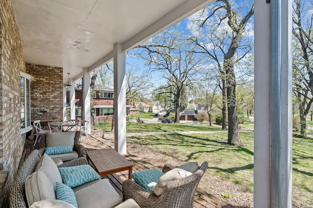 view of patio / terrace with a porch and a residential view