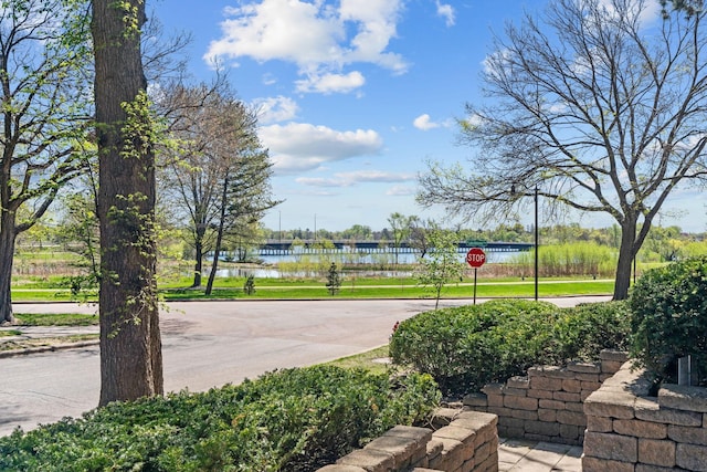 view of sport court with a water view
