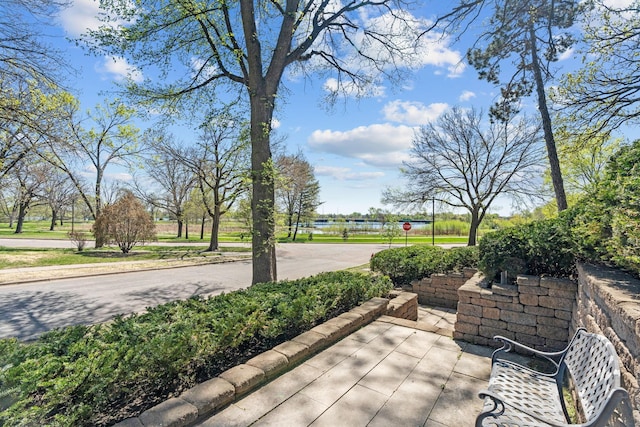 view of patio featuring a water view