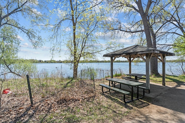 view of property's community with a water view and a gazebo
