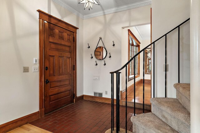 5224 17th Ave S, Minneapolis, MN 55417 - entryway featuring crown molding, stairs, and brick floors