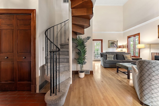 5224 17th Ave S, Minneapolis, MN 55417 - foyer featuring a high ceiling, stairway, ornamental molding, and light wood-style flooring