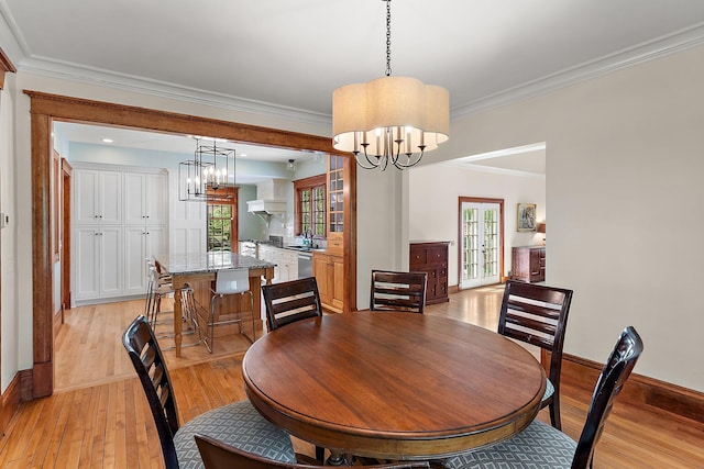 5224 17th Ave S, Minneapolis, MN 55417 - dining area with a chandelier, light wood-style floors, and ornamental molding