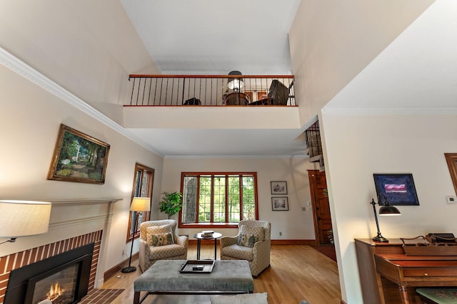 5224 17th Ave S, Minneapolis, MN 55417 - living area featuring a brick fireplace, light wood finished floors, crown molding, and a towering ceiling