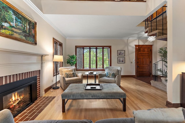 5224 17th Ave S, Minneapolis, MN 55417 - living area with a fireplace, stairway, crown molding, and wood finished floors