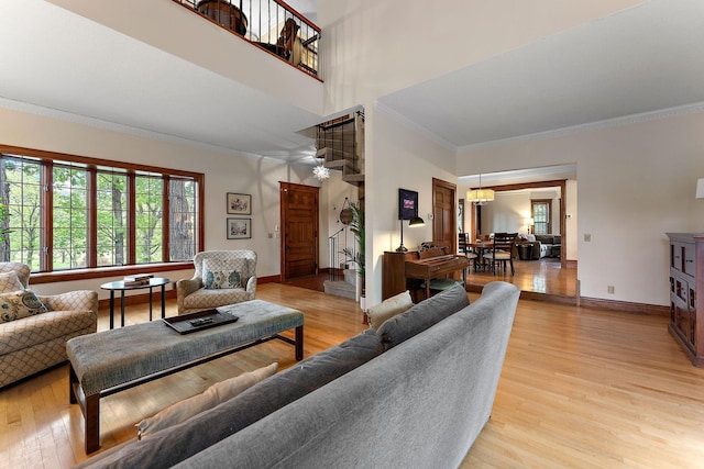5224 17th Ave S, Minneapolis, MN 55417 - living area featuring crown molding, light wood-style flooring, and a towering ceiling