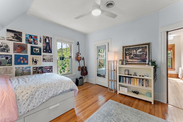 5224 17th Ave S, Minneapolis, MN 55417 - bedroom featuring wood-type flooring, ceiling fan, and radiator